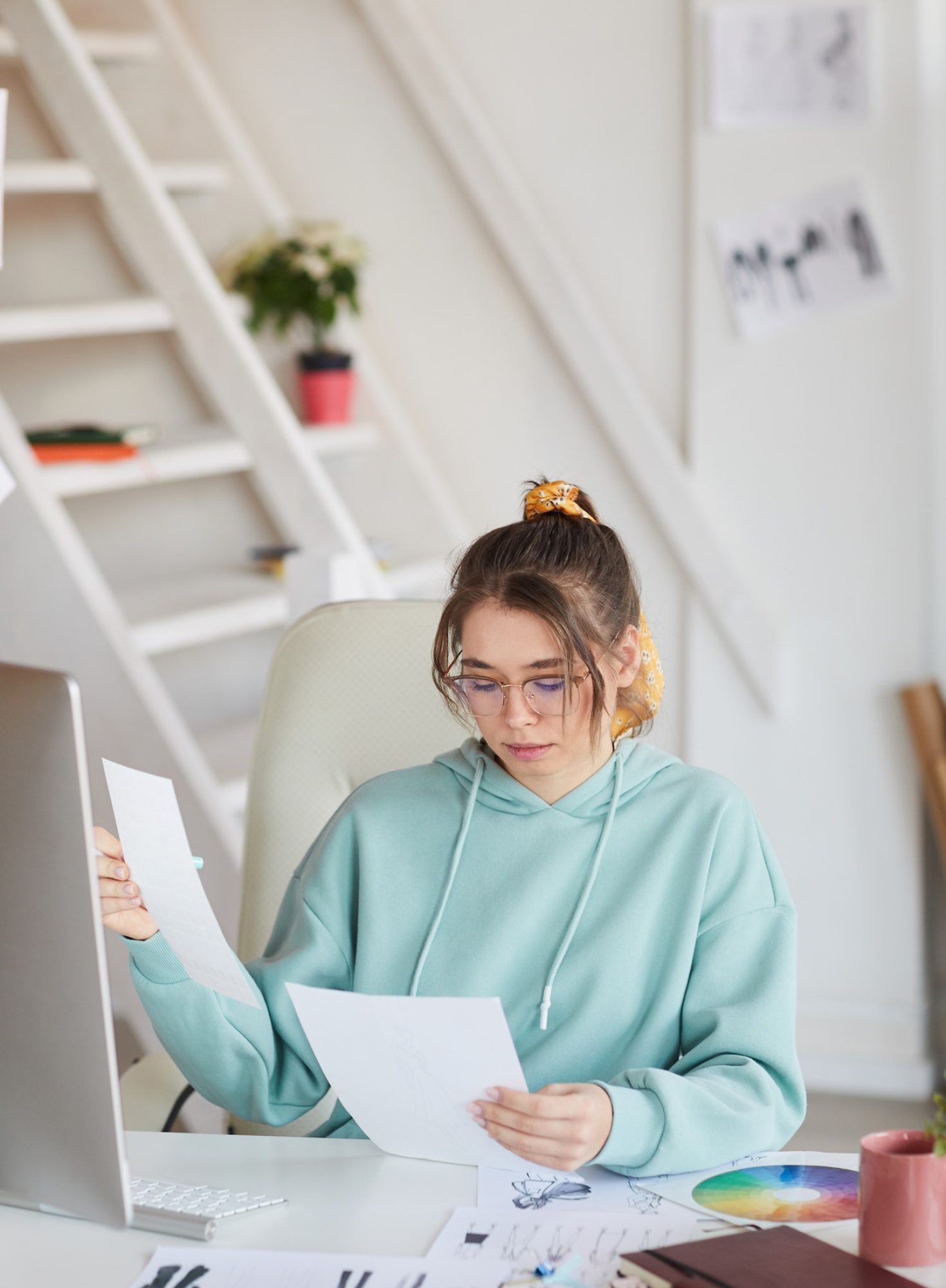 Hipster fashion designer working on sketches